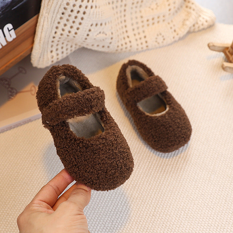 Baby or Childrens Plush Velcro Winter Shoes in cream, white, brown, black. Secure Fit: Adjustable velcro strap for easy wear and stable fit. 
Durable Sole: TPR outsole provides flexibility and long-lasting use.